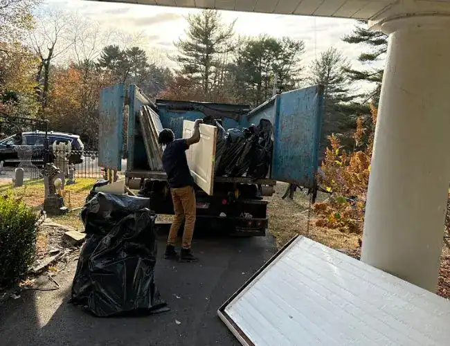 Loading Junk on the Dumpster Truck