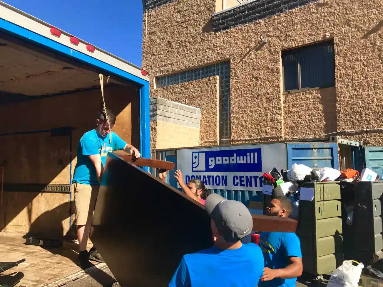 Junk Rescue Team Loading Desk From a School